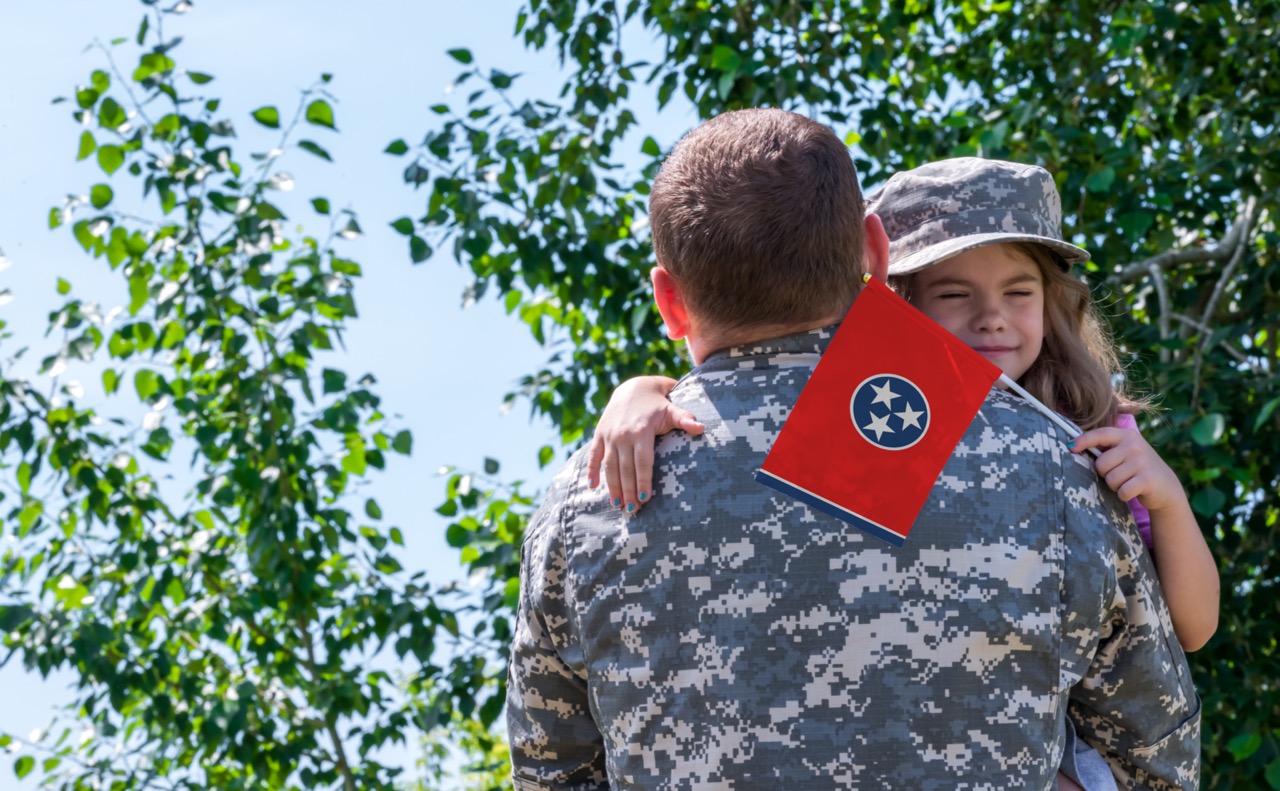 girl in tennessee hugging father returning from service